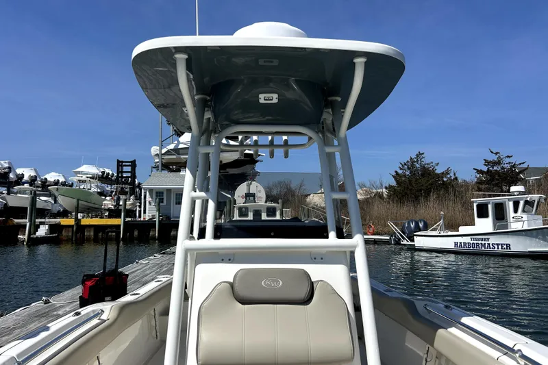 Slide: The Image of 2022 Key West 239 FS boat docked at marina, clear sky, Tisbury Harbormaster nearby. - 7