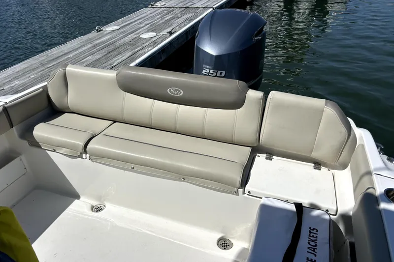 Slide: The Image of 2022 Key West 239 FS boat with Yamaha 250 engine, docked by the water. - 8
