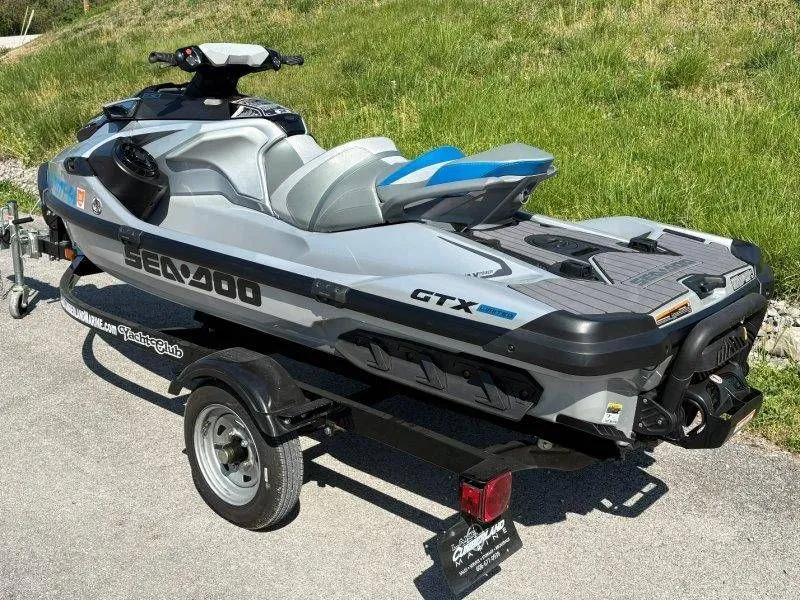 Slide: The Image of 2020 Sea-Doo GTX Limited 230 on trailer, gray color, parked outdoors. - 3