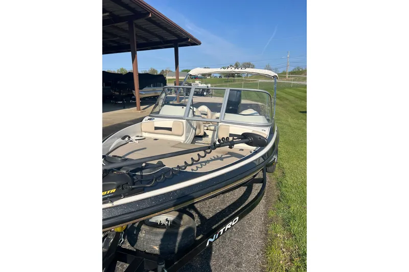 Slide: The Image of 2013 Nitro Z-7 Sport boat parked outdoors on a sunny day. - 8