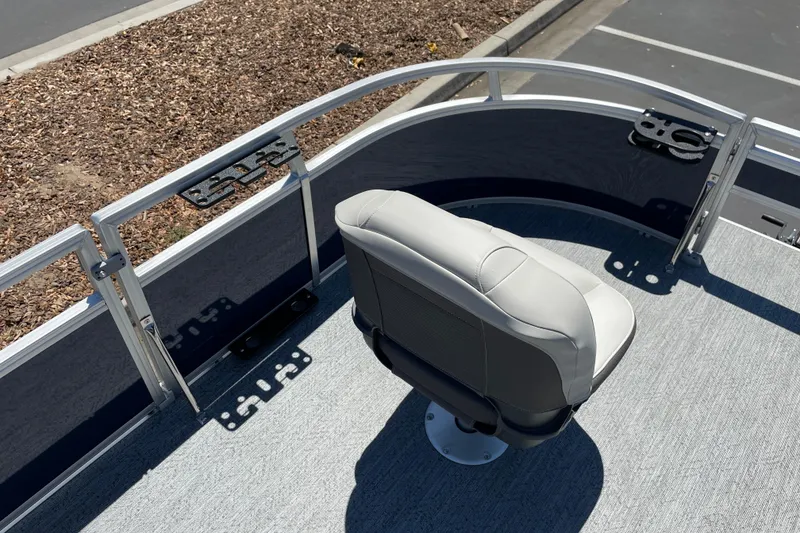 Slide: The Image of 2026 Sun Tracker Bass Buggy 16 XL Select boat seat and railing detail. - 7