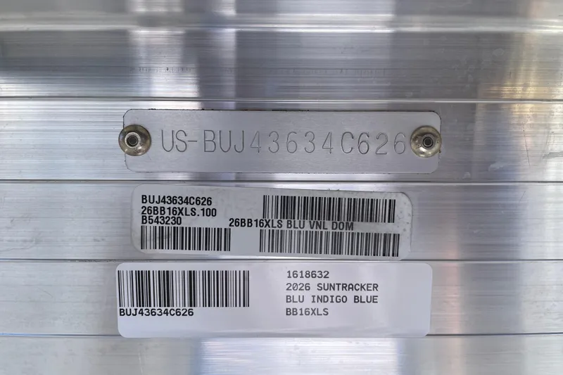 Slide: The Image of 2026 Sun Tracker Bass Buggy 16 XL Select identification plate with serial numbers and barcodes. - 103