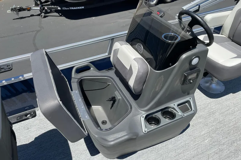 Slide: The Image of 2026 Sun Tracker Bass Buggy 16 XL Select boat interior with storage and console. - 22