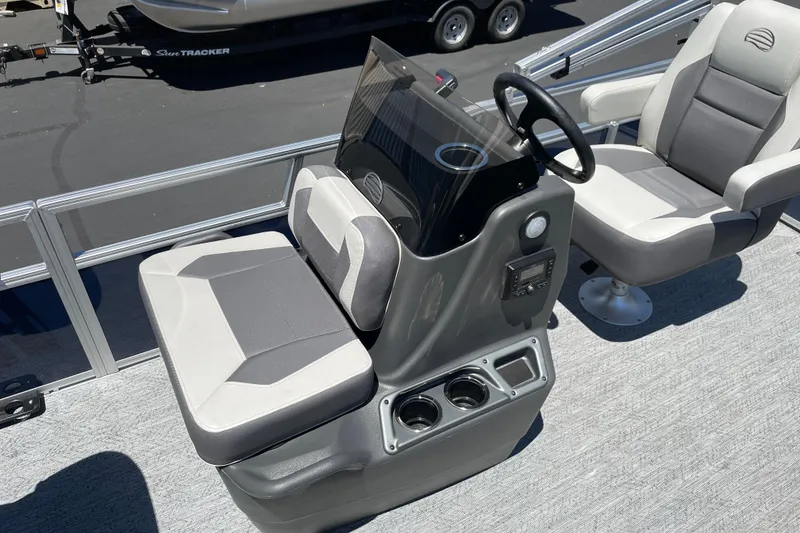 Slide: The Image of 2026 Sun Tracker Bass Buggy 16 XL Select boat interior with steering console and seating. - 21