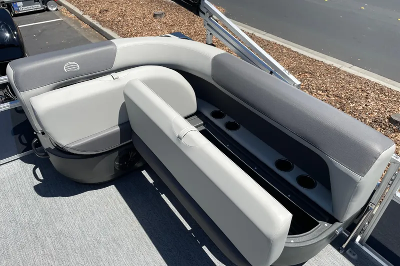 Slide: The Image of 2026 Sun Tracker Bass Buggy 16 XL Select boat seating with storage and cup holders. - 14
