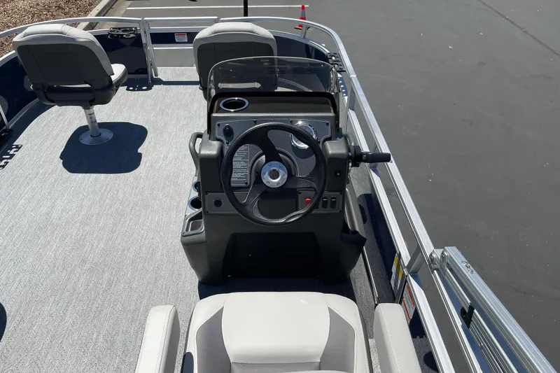 Slide: The Image of 2026 Sun Tracker Bass Buggy 16 XL Select boat interior with steering console. - 17