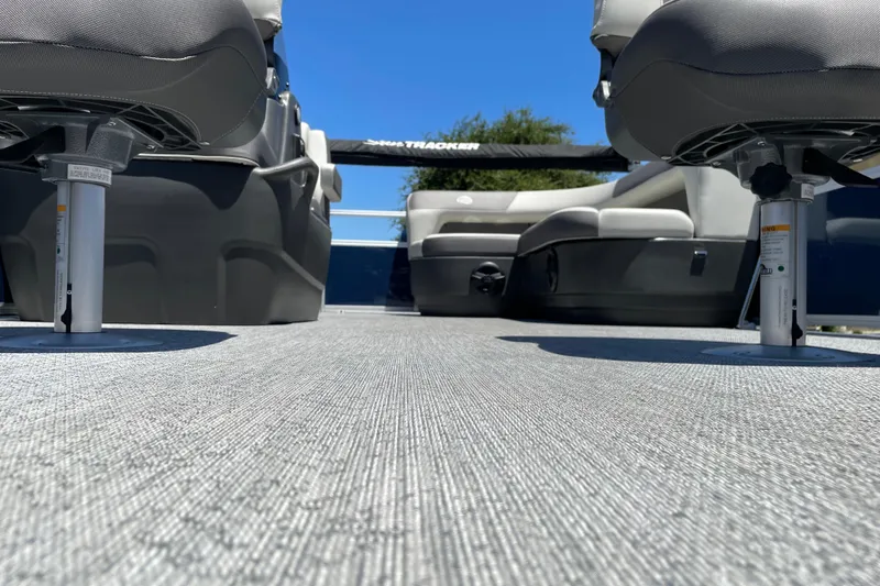 Slide: The Image of 2026 Sun Tracker Bass Buggy 16 XL Select interior with seating and flooring detail. - 28