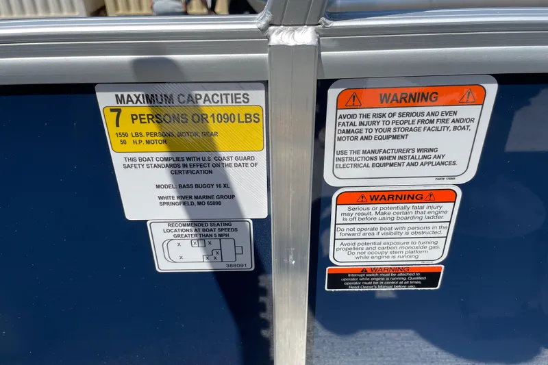 Slide: The Image of 2026 Sun Tracker Bass Buggy 16 XL Select capacity and safety warning labels. - 29
