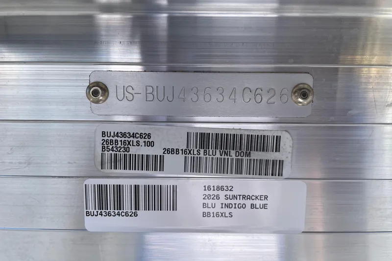 Slide: The Image of 2026 Sun Tracker Bass Buggy 16 XL Select identification plate with serial numbers and barcodes. - 102