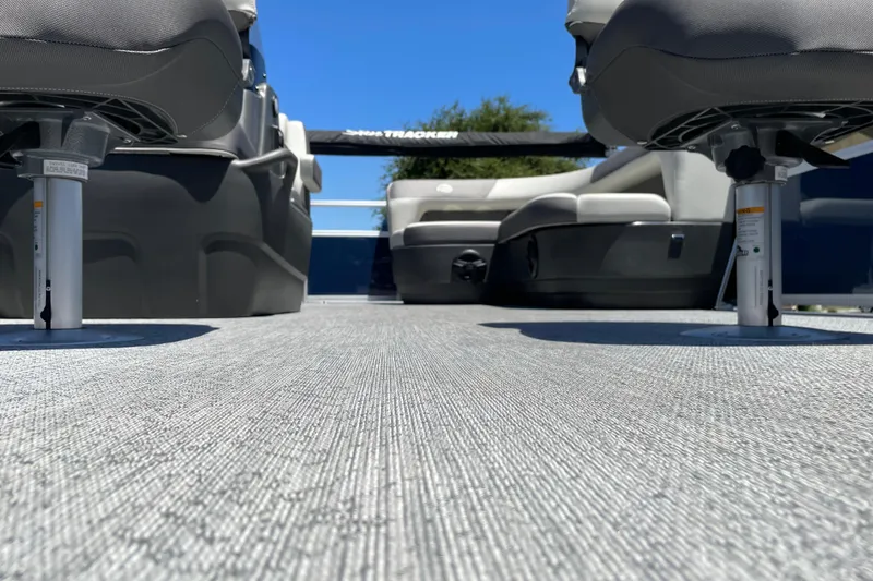 Slide: The Image of 2026 Sun Tracker Bass Buggy 16 XL Select interior with seating and textured flooring. - 27