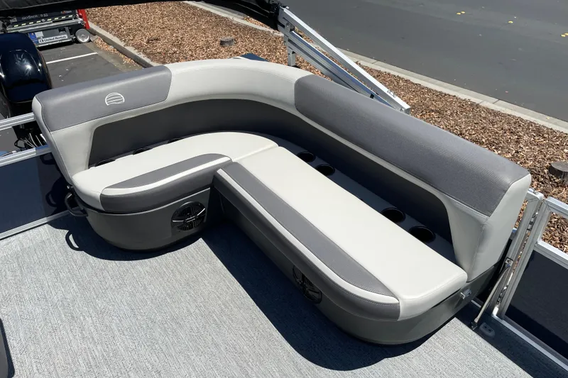 Slide: The Image of 2026 Sun Tracker Bass Buggy 16 XL Select pontoon boat seating, featuring gray and white upholstery. - 12