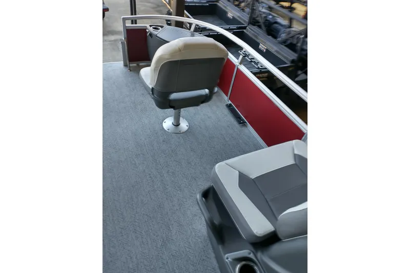 Slide: The Image of 2026 Sun Tracker Bass Buggy 18 DLX interior with seating and railing. - 10
