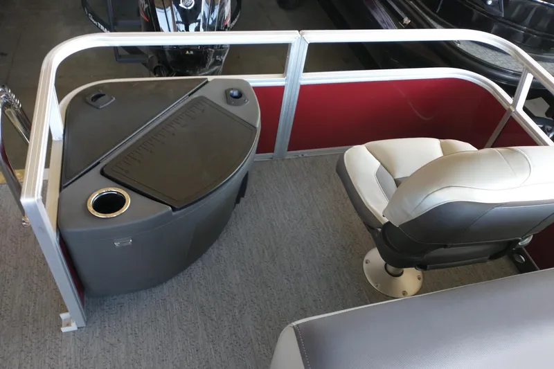 Slide: The Image of 2026 Sun Tracker Bass Buggy 18 DLX interior with seating and console. - 6
