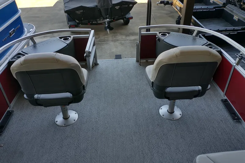Slide: The Image of 2026 Sun Tracker Bass Buggy 18 DLX pontoon boat with dual swivel seats and cup holders. - 9
