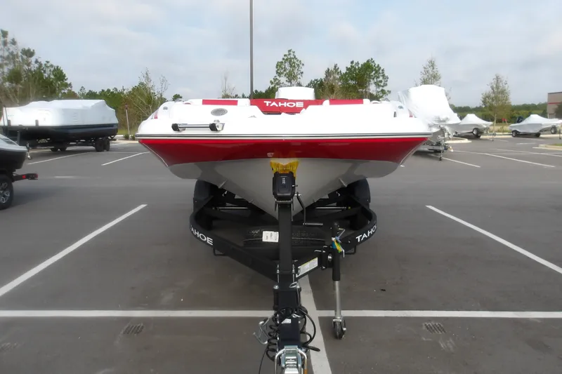 Slide: The Image of 2026 Tahoe 2150 boat on trailer in parking lot, front view. - 4