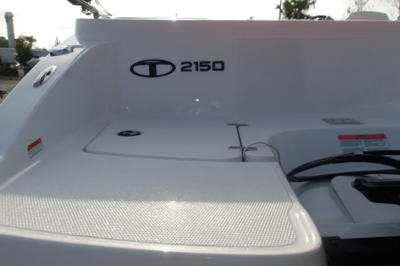 Slide: The Image of 2026 Tahoe 2150 boat deck with logo and storage compartments. - 7