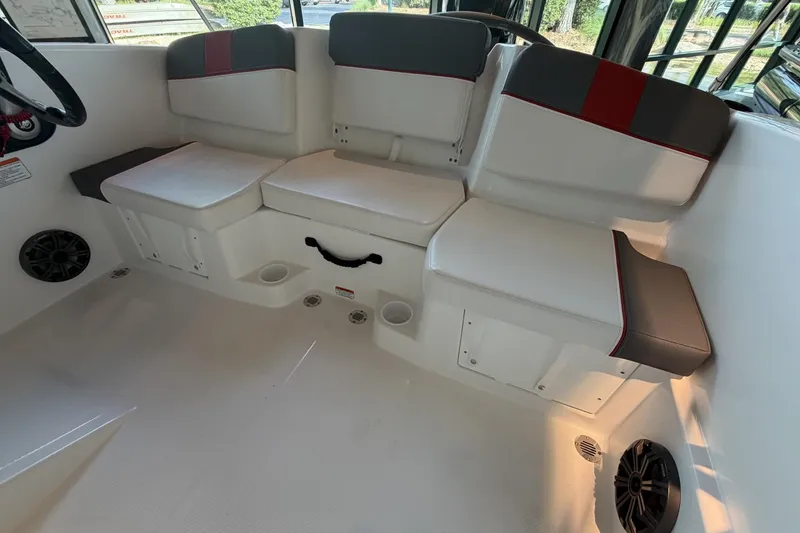 Slide: The Image of Interior seating of 2026 Tahoe T16 boat with white and gray upholstery. - 4