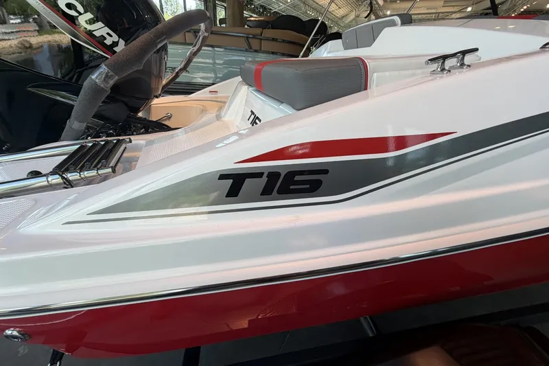 Slide: The Image of The image shows a white boat with red accents and "T16" written on the side. - 3