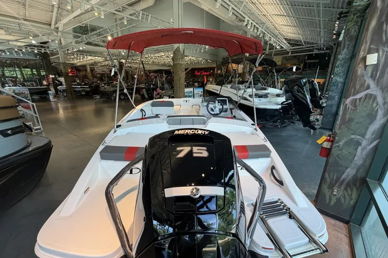 Slide: The Image of 2026 Tahoe T16 boat with Mercury 75 engine in showroom display. - 7