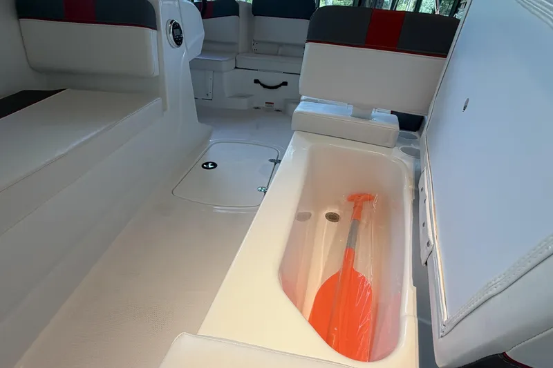 Slide: The Image of Interior of 2026 Tahoe T16 boat with storage compartment and paddle. - 9