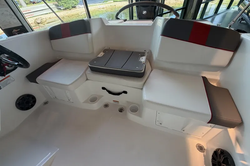 Slide: The Image of 2026 Tahoe T16 boat interior with white and gray seating, featuring red accents. - 5