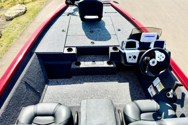 Slide: The Image of 2026 Tracker Pro Team 195 boat interior with steering console and seating. - 62
