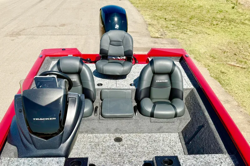 Slide: The Image of 2026 Tracker Pro Team 195 boat interior with three seats and steering console. - 61