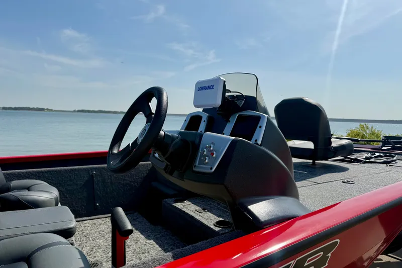 Slide: The Image of 2026 Tracker Pro Team 195 boat interior with steering wheel and navigation system. - 56