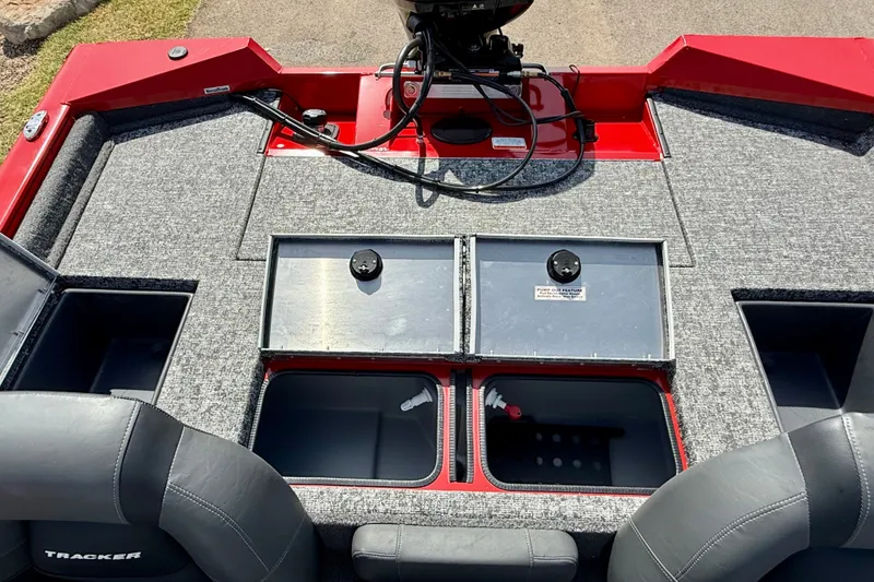 Slide: The Image of 2026 Tracker Pro Team 195 boat interior with storage compartments and seating. - 68