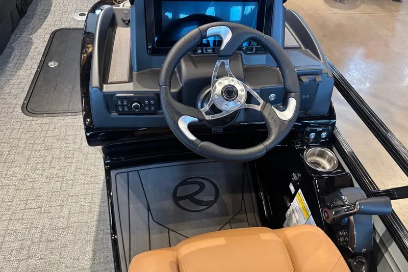 Slide: The Image of 2026 Regency 250 DL boat dashboard with steering wheel and control panel. - 9