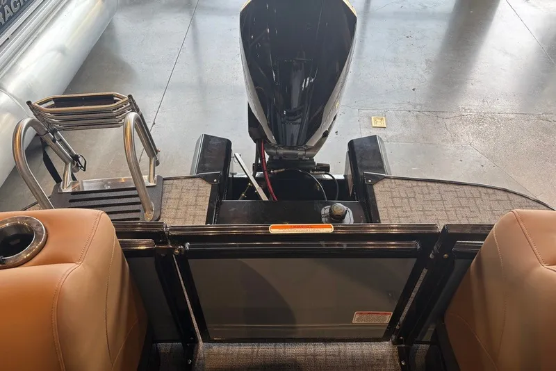 Slide: The Image of 2026 Regency 250 DL boat interior with motor and seating area. - 16