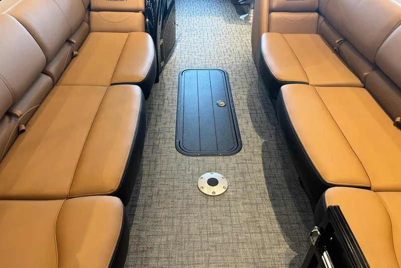 Slide: The Image of Luxurious interior of 2026 Regency 250 DL boat with tan leather seating. - 2
