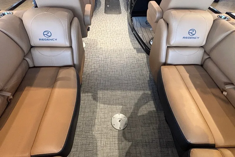 Slide: The Image of Luxurious interior of 2026 Regency 250 DL boat with tan leather seating. - 7