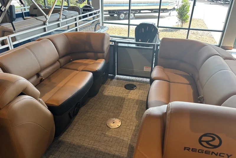 Slide: The Image of Luxurious interior of 2026 Regency 250 DL pontoon boat with plush seating. - 4