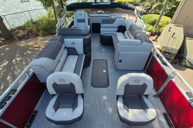 Slide: The Image of 2026 Sun Tracker Fishin' Barge 22 XP3 interior with spacious seating and modern design. - 12