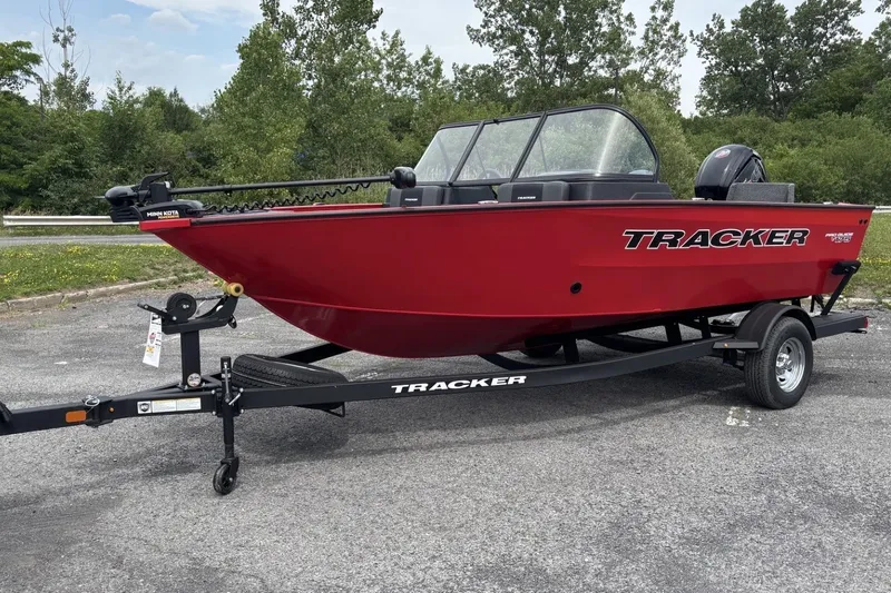 Slide: The Image of 2026 Tracker Pro Guide V-175 Combo boat in vibrant red on a trailer. - 3