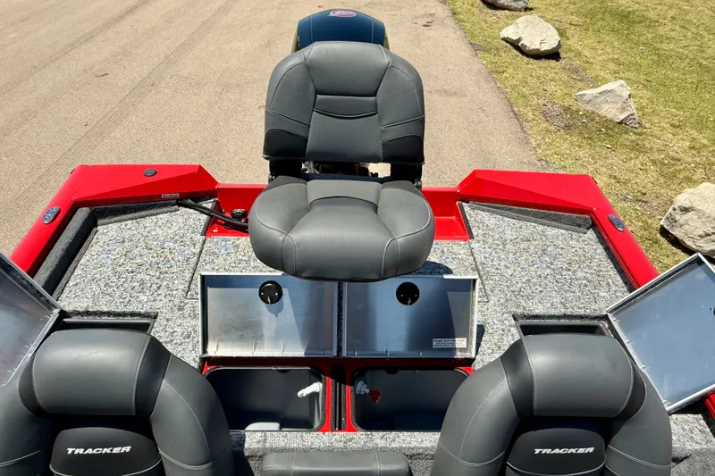 Slide: The Image of 2026 Tracker Pro Team 195 boat interior with gray seating and storage compartments. - 16