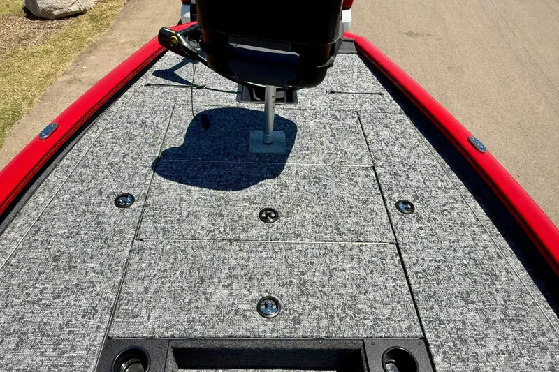 Slide: The Image of 2026 Tracker Pro Team 195 boat deck with gray carpet and red trim. - 7