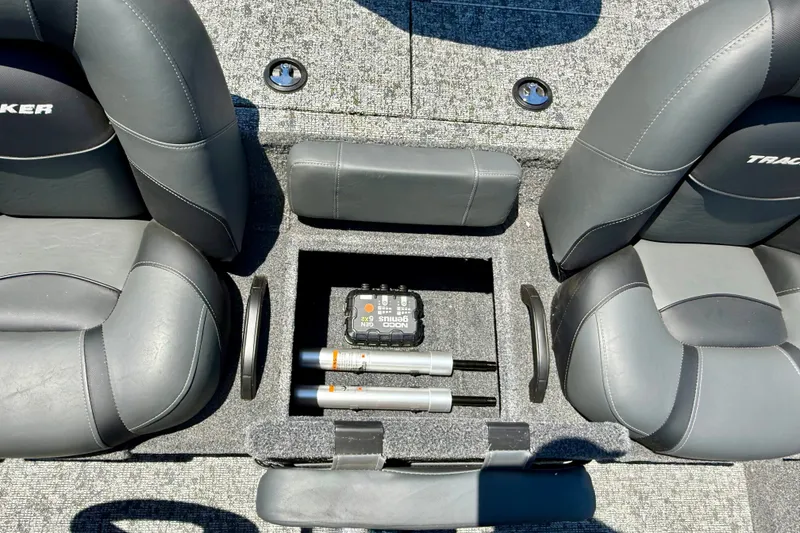 Slide: The Image of Interior of 2026 Tracker Pro Team 195 boat with storage compartment and seating. - 13