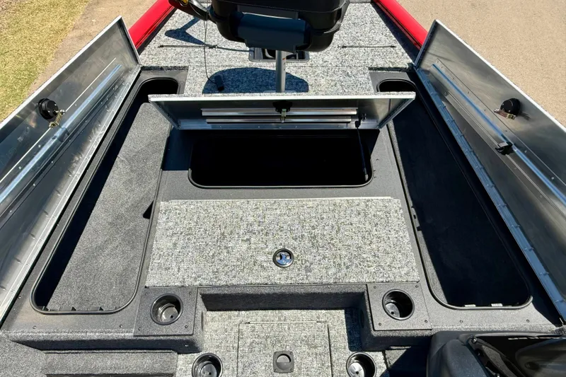 Slide: The Image of 2026 Tracker Pro Team 195 boat interior with open storage compartments and seating. - 9