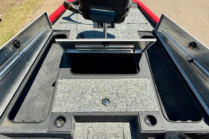 Slide: The Image of 2026 Tracker Pro Team 195 boat interior with open storage compartments. - 8