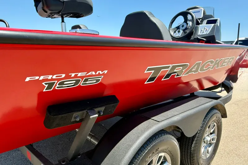 Slide: The Image of Red 2026 Tracker Pro Team 195 boat on trailer, showcasing sleek design and branding. - 4