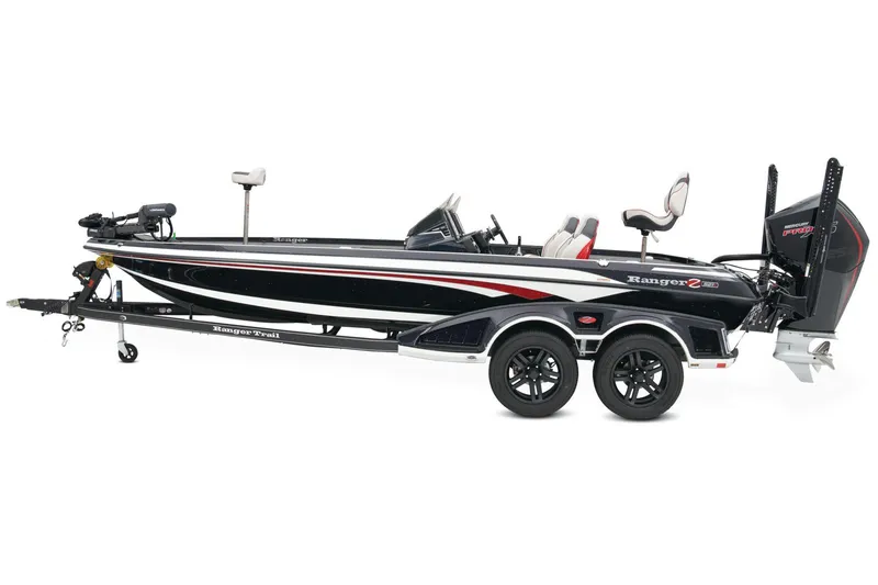 Slide: The Image of 2026 Ranger Z521R Cup-Equipped boat parked on a paved road, surrounded by greenery. - 2