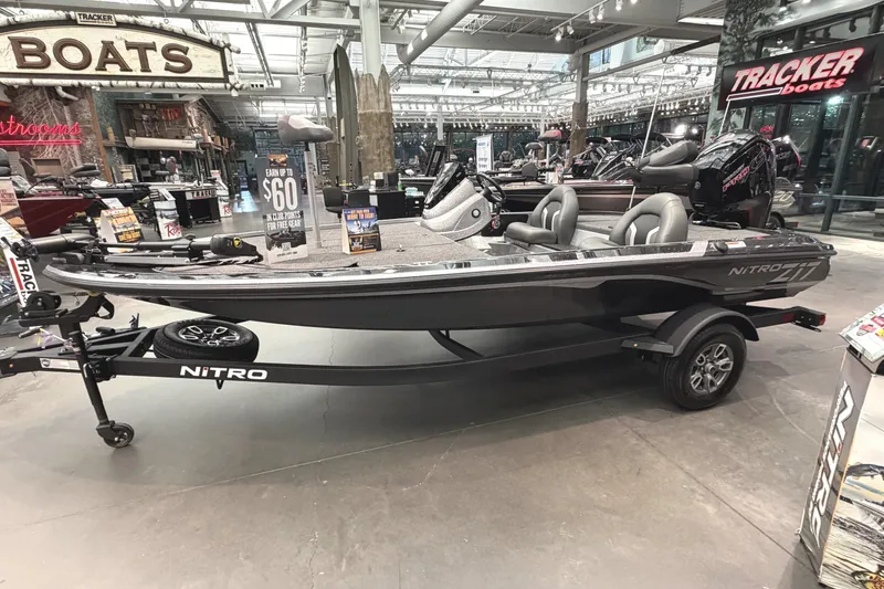 Slide: The Image of 2026 Nitro Z17 boat displayed in showroom with Tracker branding. - 1