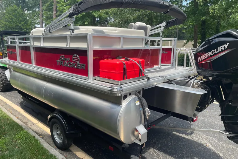 Slide: The Image of 2026 Sun Tracker Bass Buggy 16 XL Select pontoon boat with Mercury outboard motor. - 5