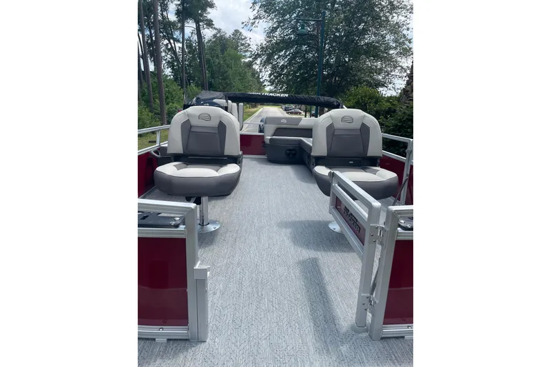 Slide: The Image of 2026 Sun Tracker Bass Buggy 16 XL Select pontoon boat interior with seating and open deck. - 2