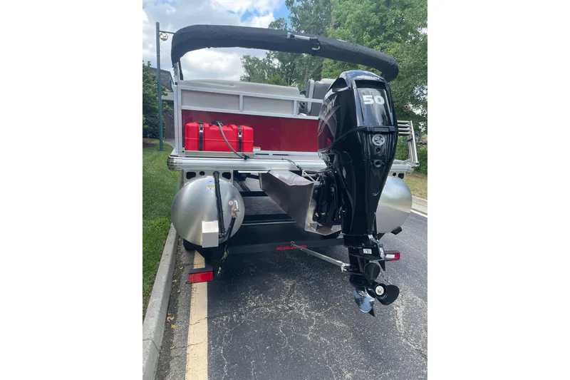 Slide: The Image of 2026 Sun Tracker Bass Buggy 16 XL Select pontoon boat with outboard motor. - 4