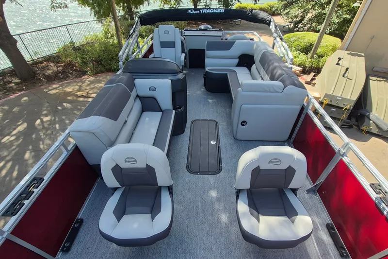Slide: The Image of 2026 Sun Tracker Fishin' Barge 22 XP3 interior with spacious seating and modern design. - 12