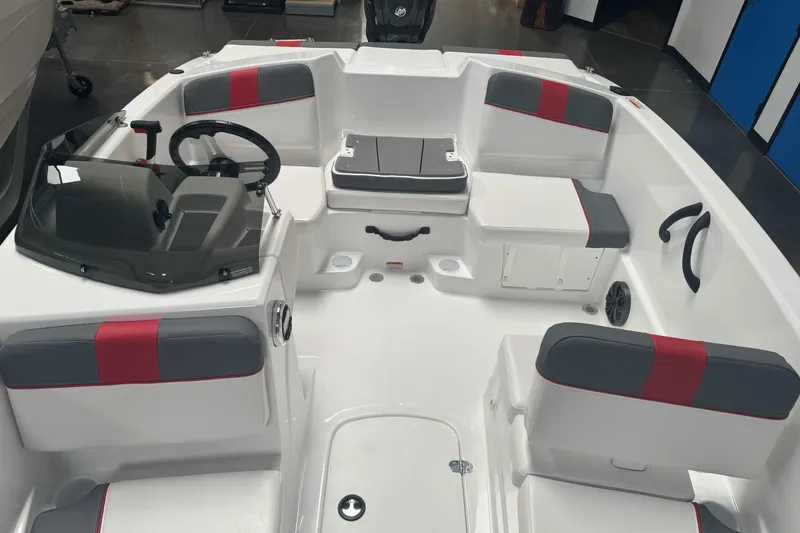 Slide: The Image of 2026 Tahoe T16 boat interior with modern seating and steering console. - 10