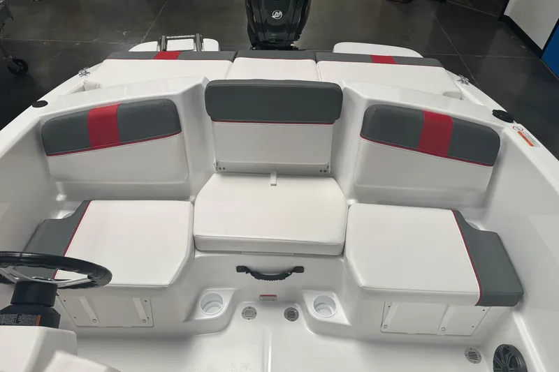 Slide: The Image of 2026 Tahoe T16 boat interior with gray and red cushioned seating. - 11